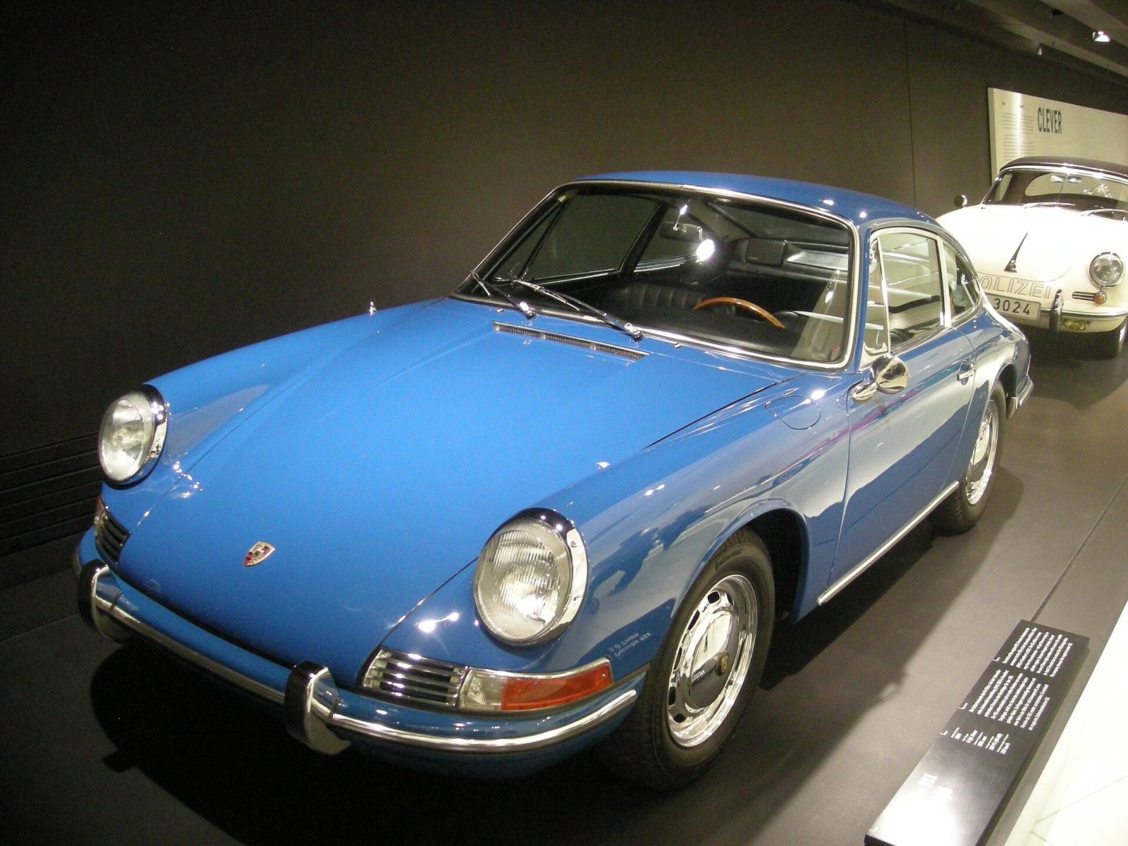 Blue 1965 Porsche 911 coupé on display in the Porsche Museum