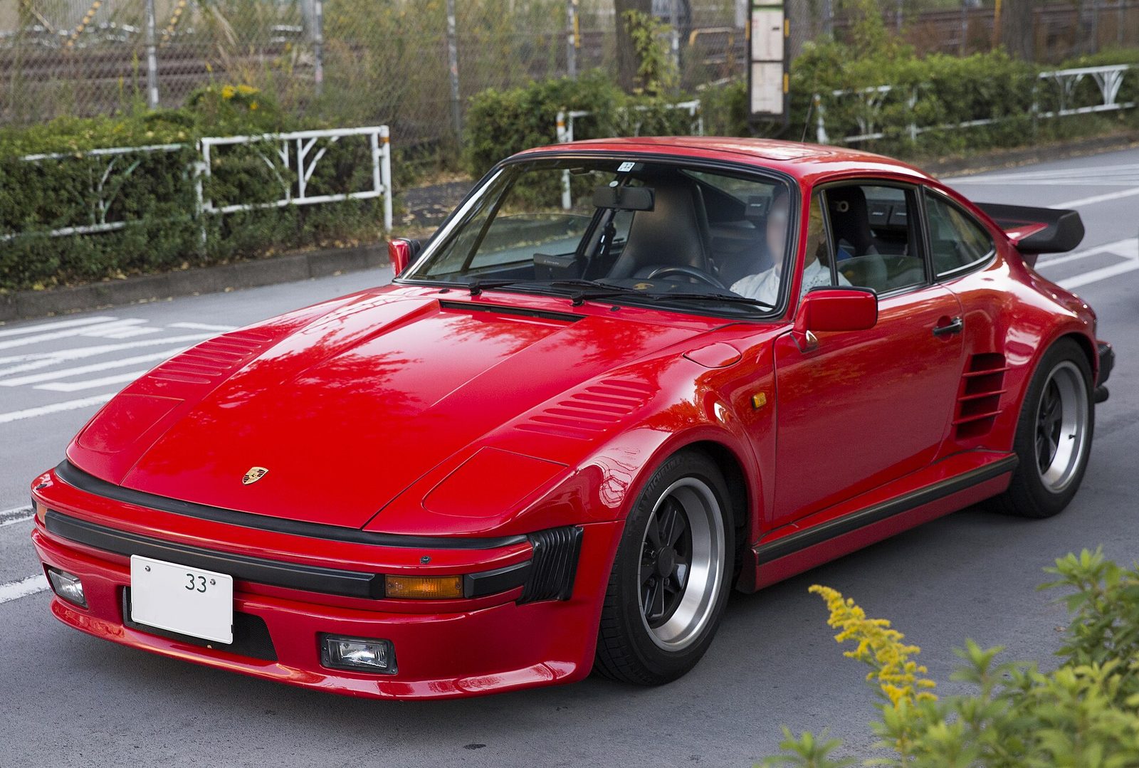 Red Porsche 930 Turbo Flachbau with pop-up headlights